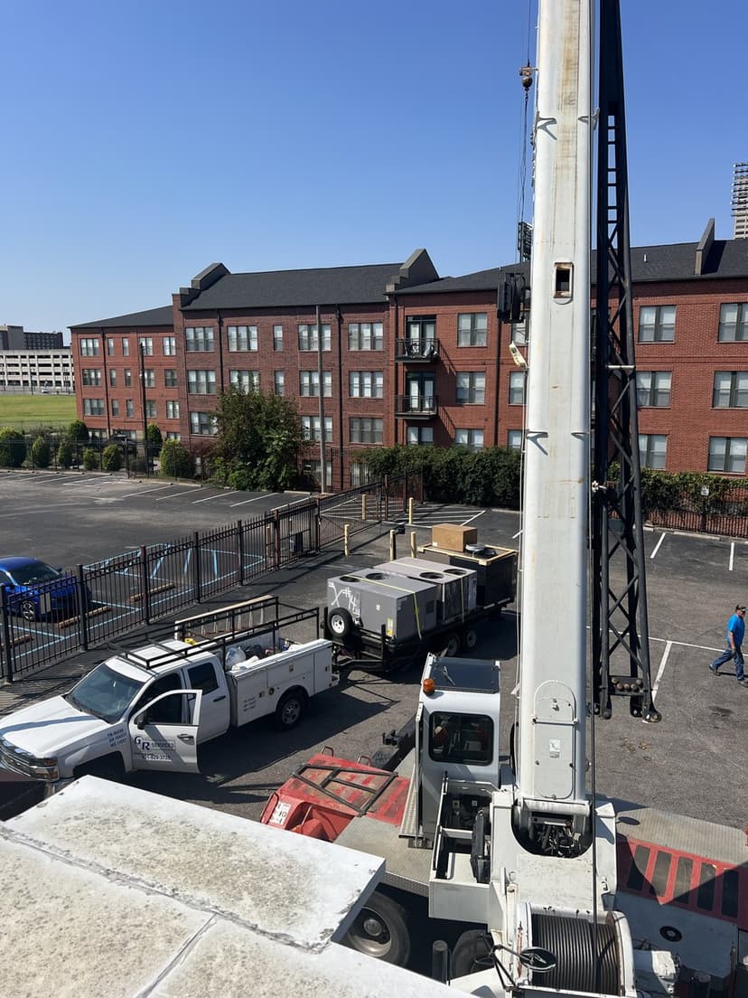 G & R Services trucks and equipment at commercial job site